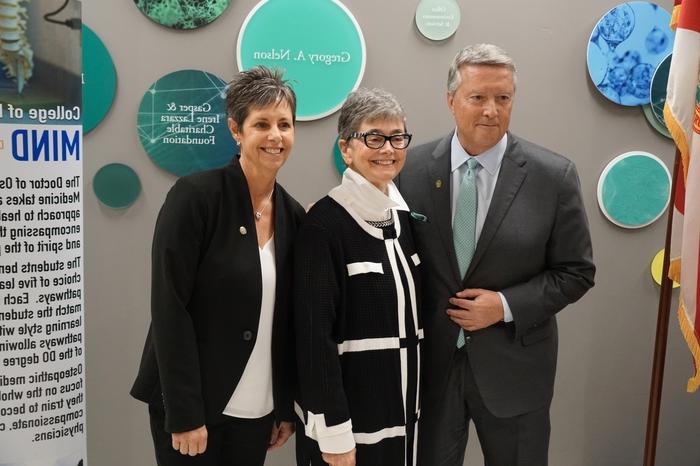 Dr. Christine Sapienza, Dr. Silvia Ferretti, and President Tim Cost pose for a photo